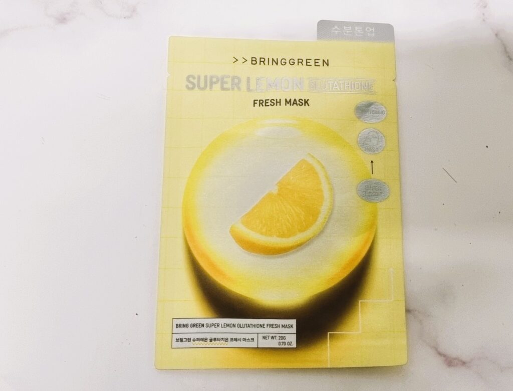 Mặt nạ BRINGGREEN Super Lemon Glutathione dạng gói – bao bì mặt trước màu vàng với lát chanh